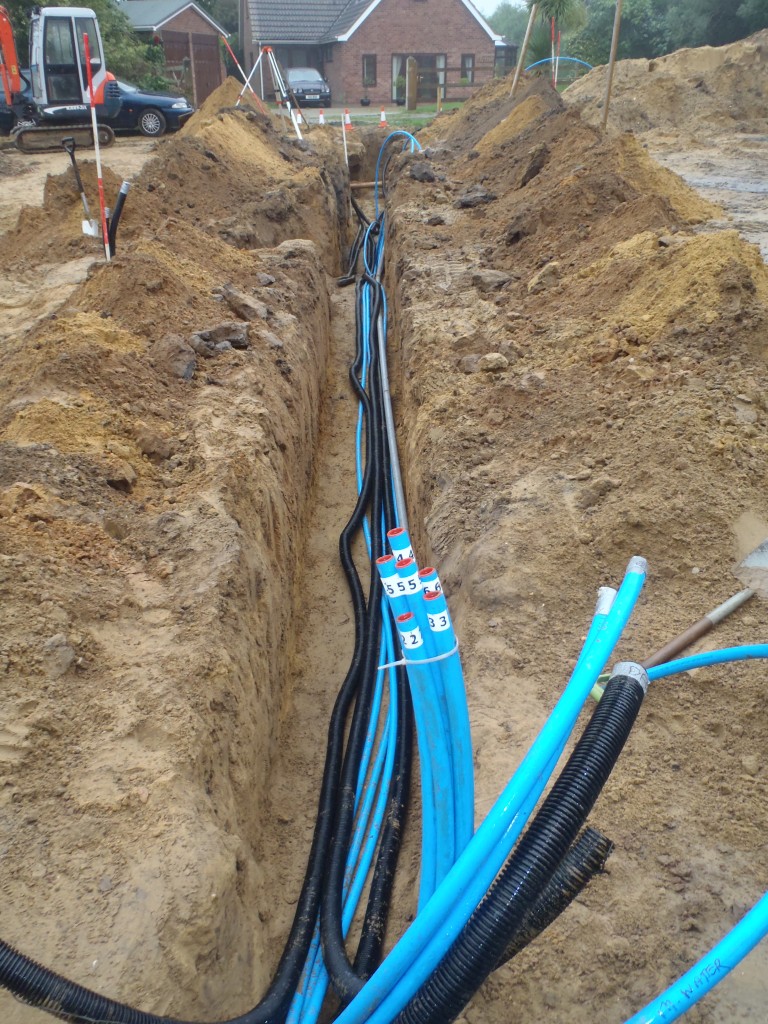 trench with most pipes and conduits in