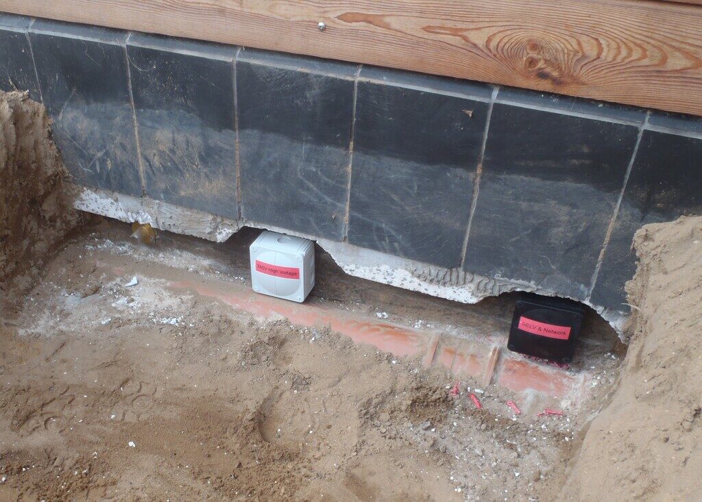 Installed Dozens of Conduits and Pipes through the External Wall for Future Expansion