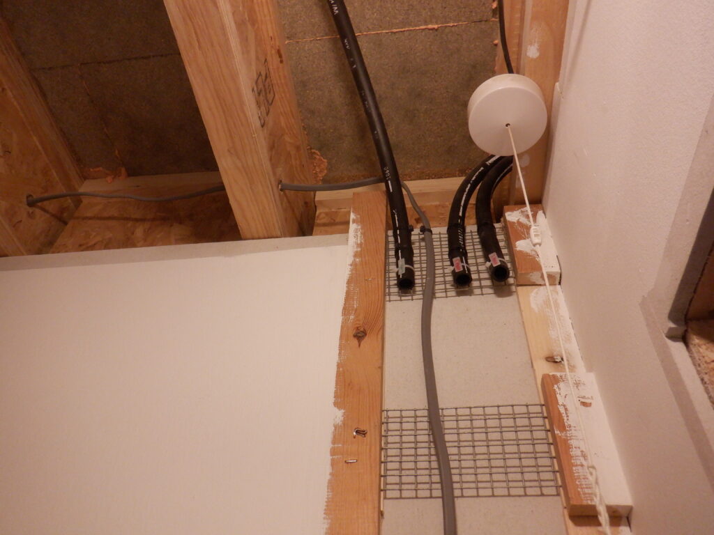 Tech Cupboard mains conduits in ceiling