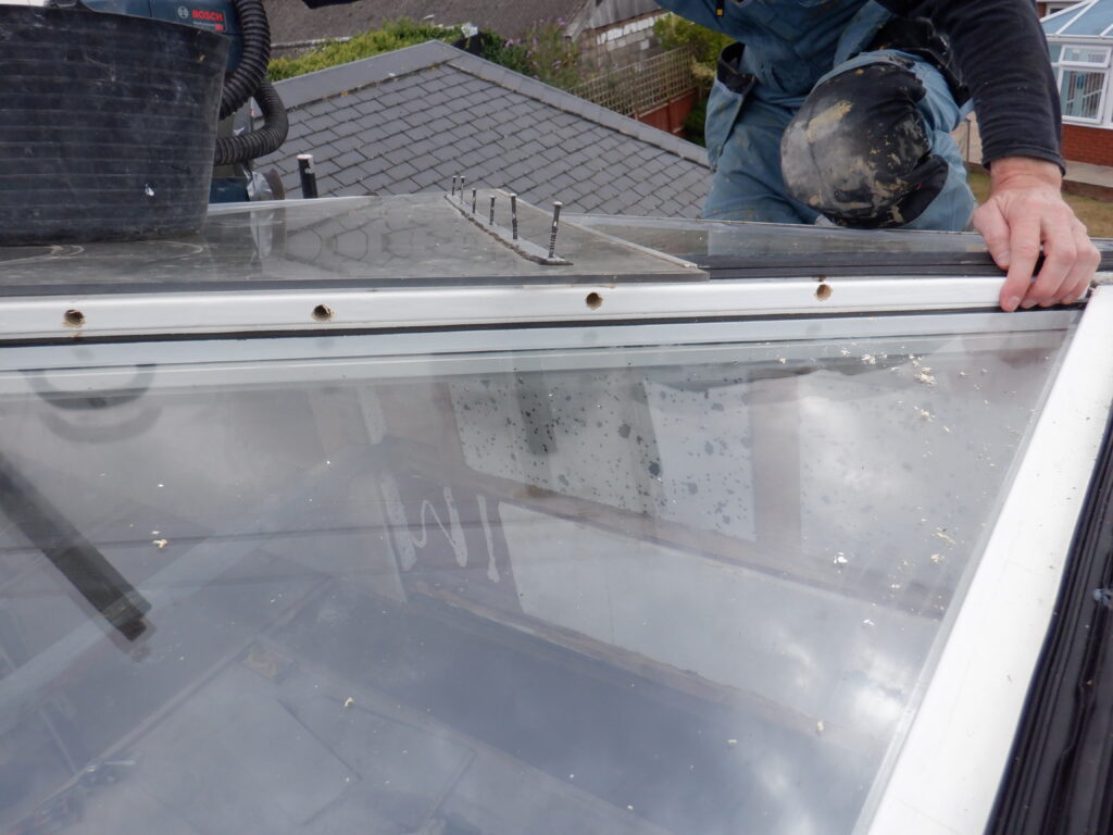 Drill holes to join up the window spaces